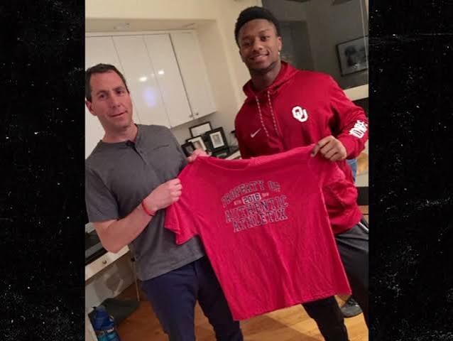 Peter Schaffer with a newly signed client holding an Authentic Athletix shirt